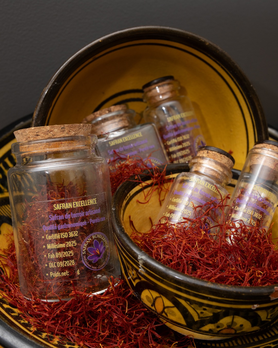 Safran Excellence bottles of saffron in Moroccan bowls